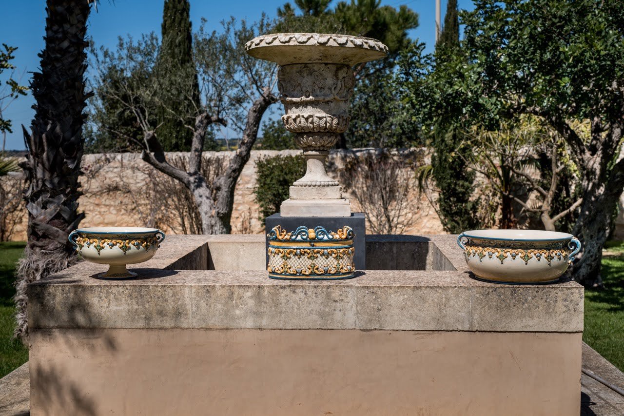 Collection of hand-painted Caltagirone vases on display