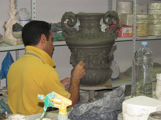 Nicola Intonato modelling a relief vase in the workshop